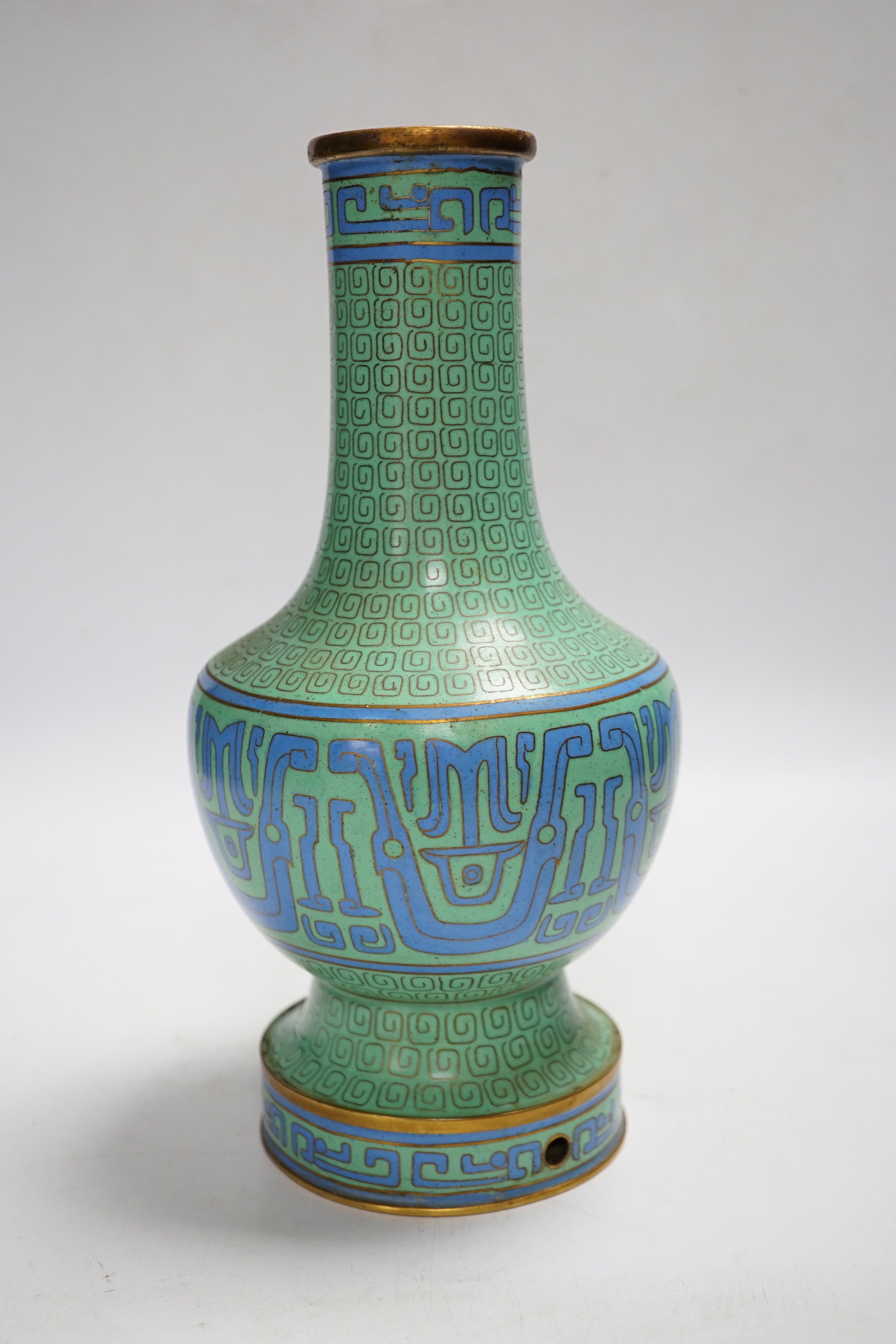 A Chinese green cloisonné enamel vase, hole to base, 27cm high